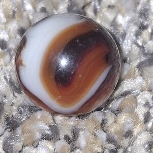 Elegant Brown and White Swirl Jewelry Piece